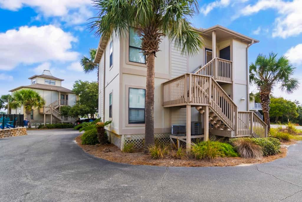 Gorgeous coastal townhome with private balcony, porch, WD,  and shared pool