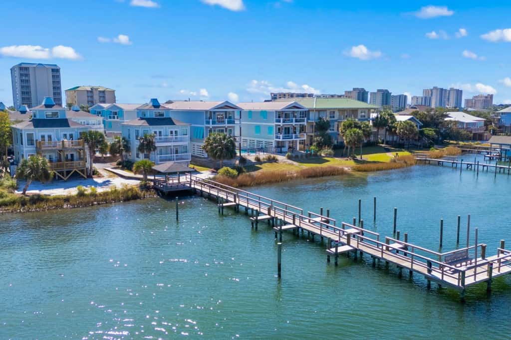 Gorgeous coastal townhome with private balcony, porch, WD,  and shared pool