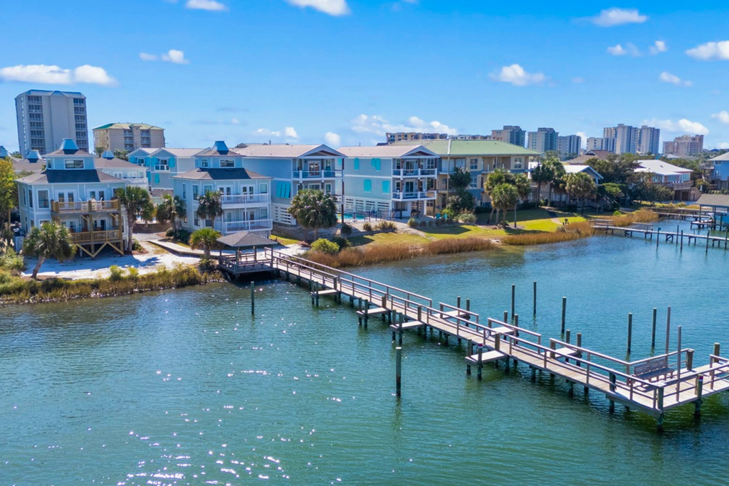 Gorgeous coastal townhome with private balcony, porch, WD,  and shared pool