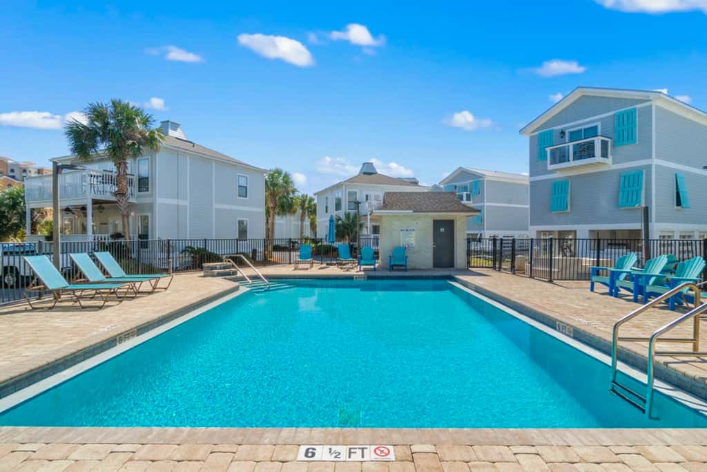 Gorgeous coastal townhome with private balcony, porch, WD,  and shared pool