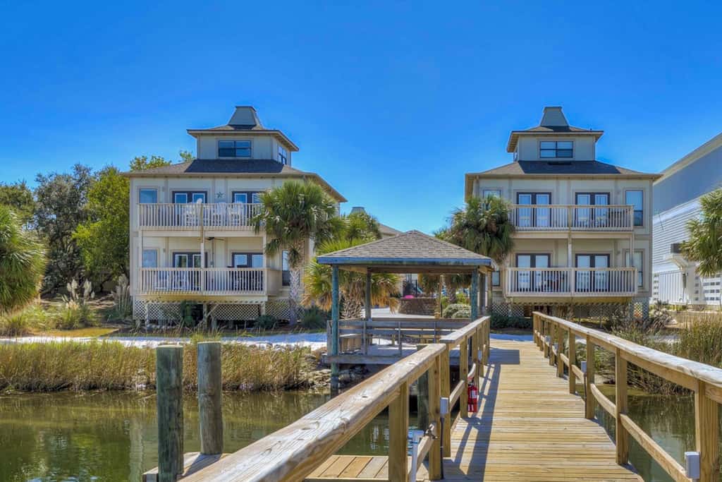 Gorgeous coastal townhome with private balcony, porch, WD,  and shared pool