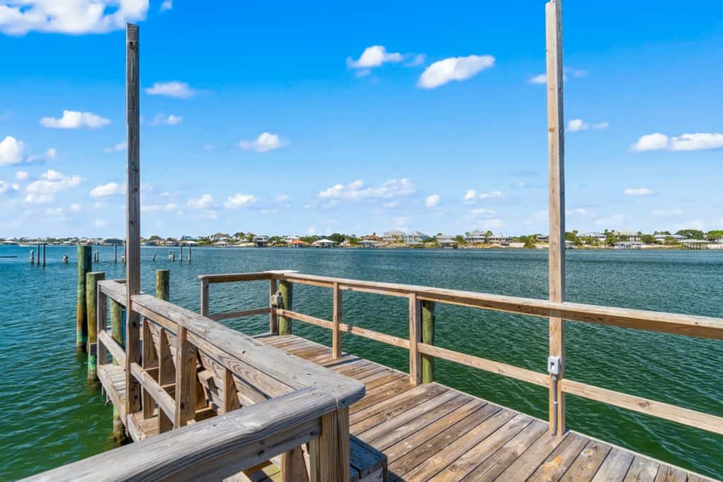 Gorgeous coastal townhome with private balcony, porch, WD,  and shared pool