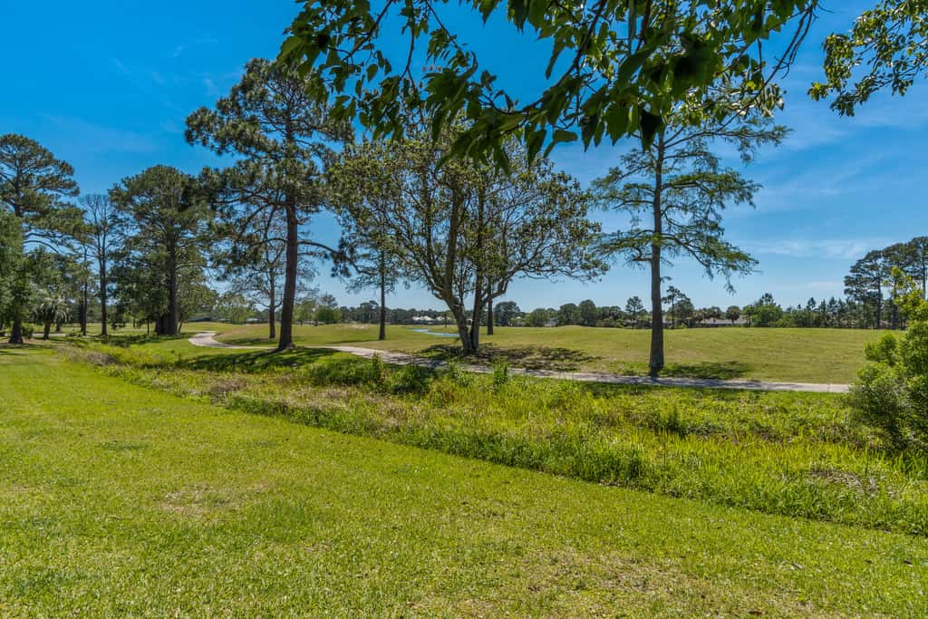 Dog friendly coastal townhome with golf course views, patios, and washer, dryer