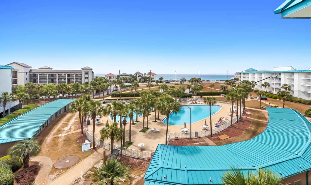 Fourth-floor, ocean-view condo with pool, high-speed WiFi, beach access & W&D