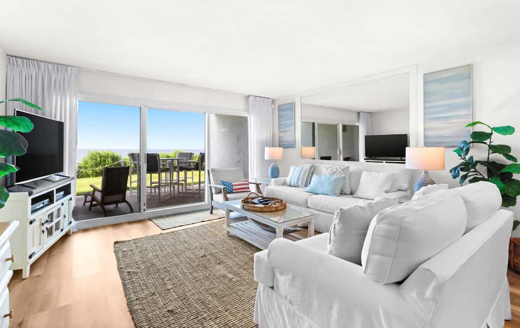 Ground floor oceanfront beachy condo with furnished patio, outdoor pool, gym