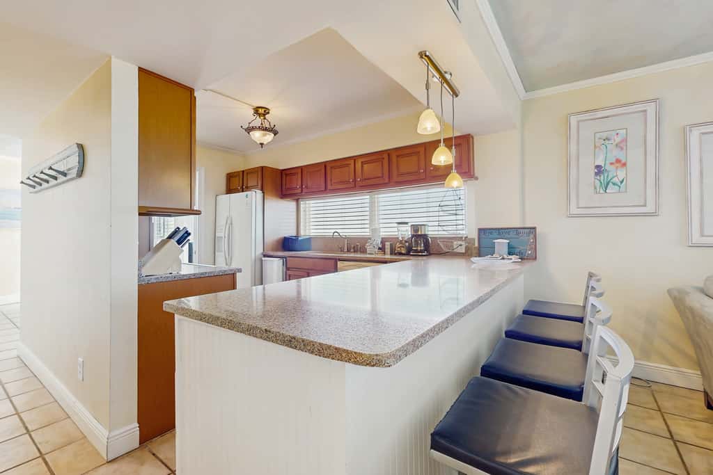Spacious beachfront condo with full kitchen, shared pool and beach access