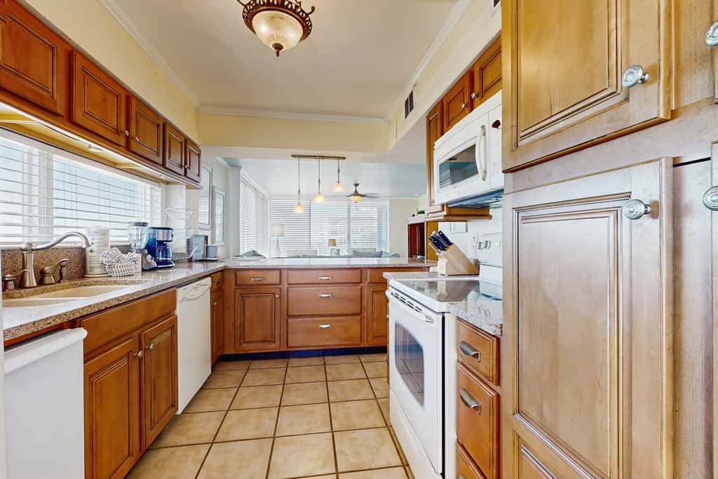 Spacious beachfront condo with full kitchen, shared pool and beach access
