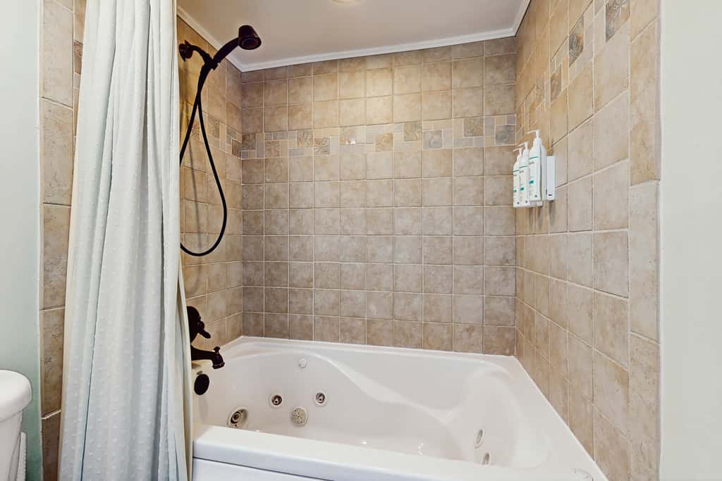 Spacious beachfront condo with full kitchen, shared pool and beach access