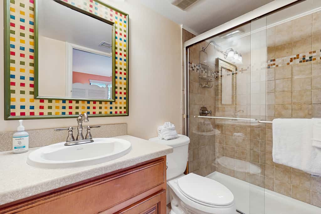 Spacious beachfront condo with full kitchen, shared pool and beach access