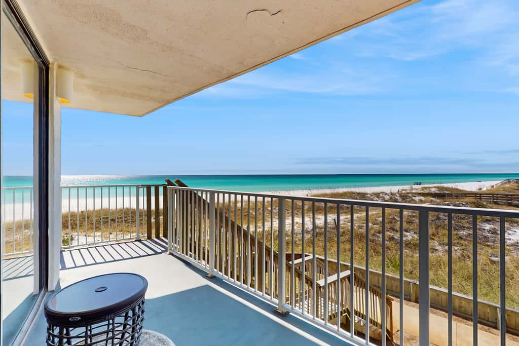 Spacious beachfront condo with full kitchen, shared pool and beach access