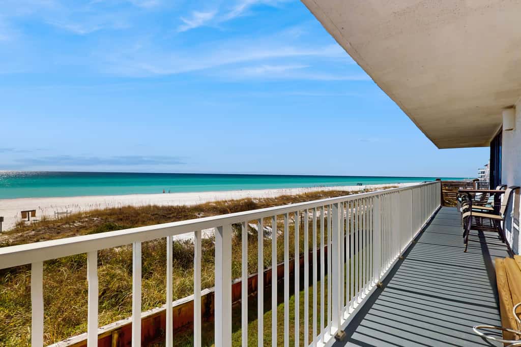 Spacious beachfront condo with full kitchen, shared pool and beach access