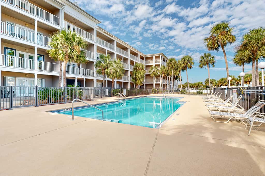 Sunny condo with pool, hot tub, pool views, balcony, & AC
