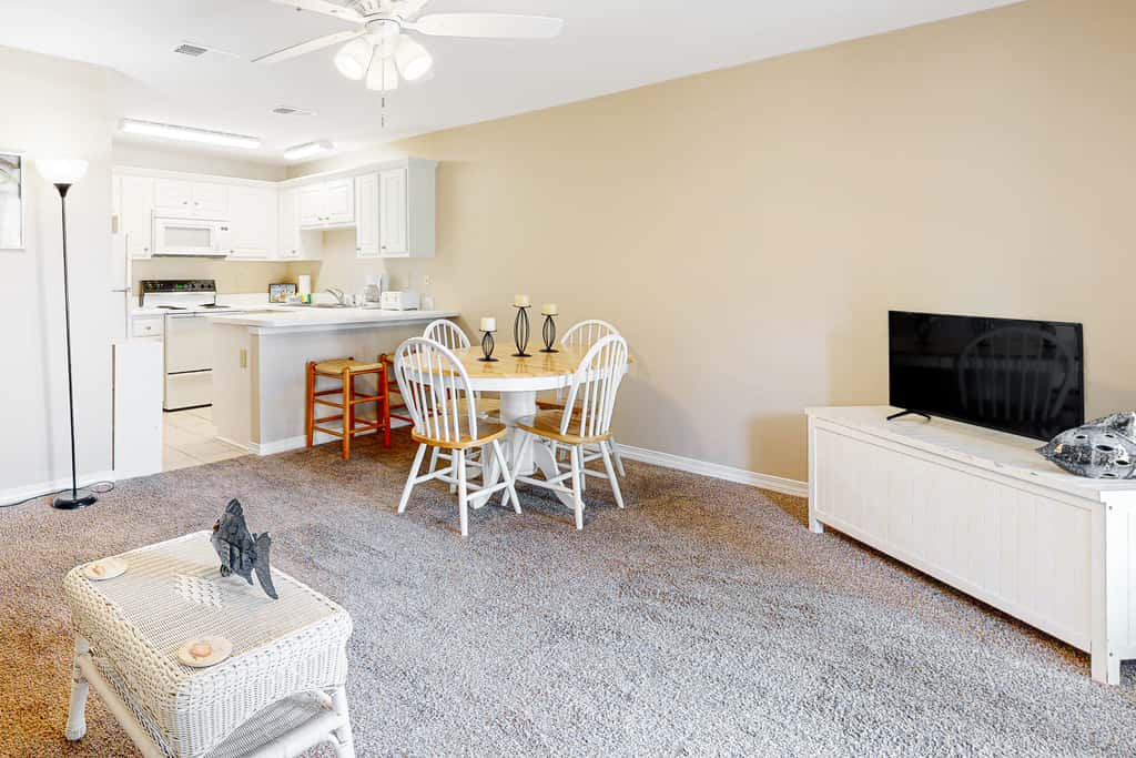 Sunny condo with pool, hot tub, pool views, balcony, & AC