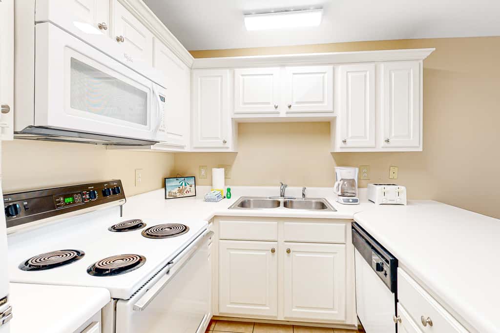 Sunny condo with pool, hot tub, pool views, balcony, & AC