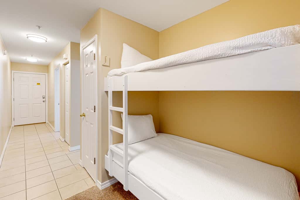 Sunny condo with pool, hot tub, pool views, balcony, & AC