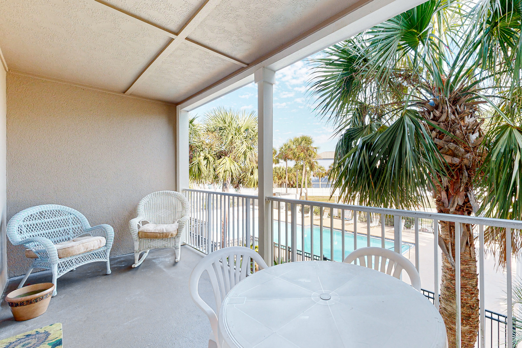 Sunny condo with pool, hot tub, pool views, balcony, & AC