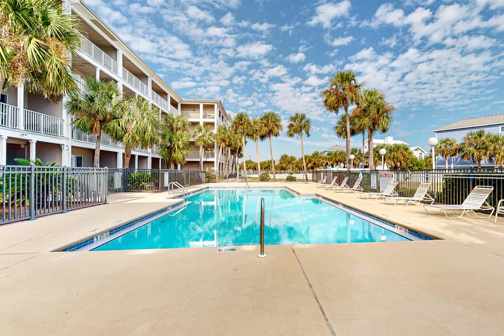 Sunny condo with pool, hot tub, pool views, balcony, & AC