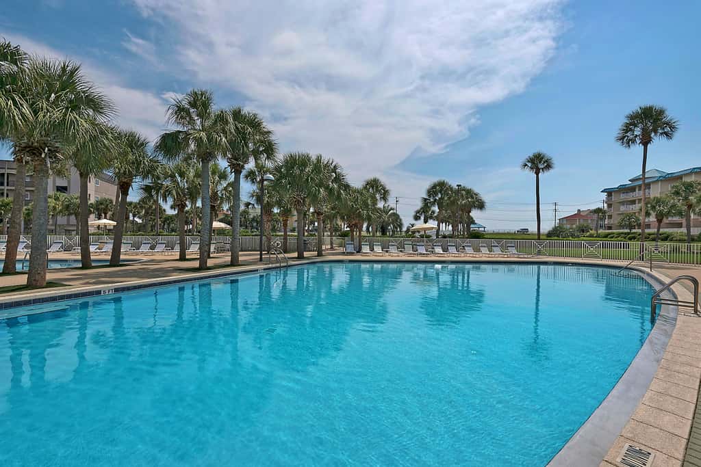 Ground-floor condo with large patio, pools, tennis, & parking - steps to beach