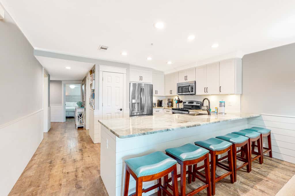 Ground-floor condo with large patio, pools, tennis, & parking - steps to beach