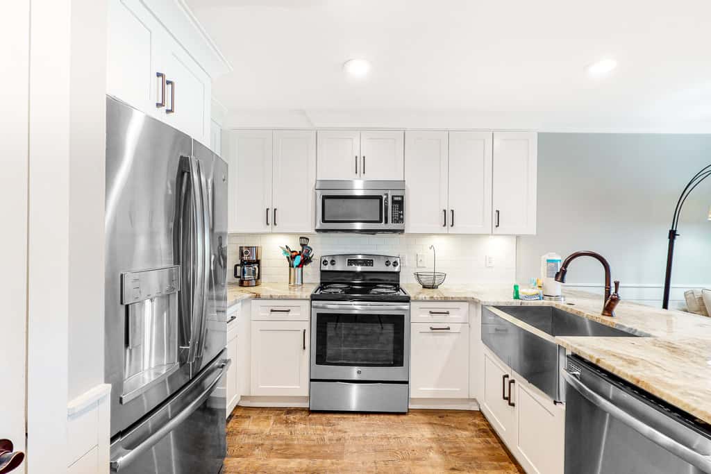 Ground-floor condo with large patio, pools, tennis, & parking - steps to beach