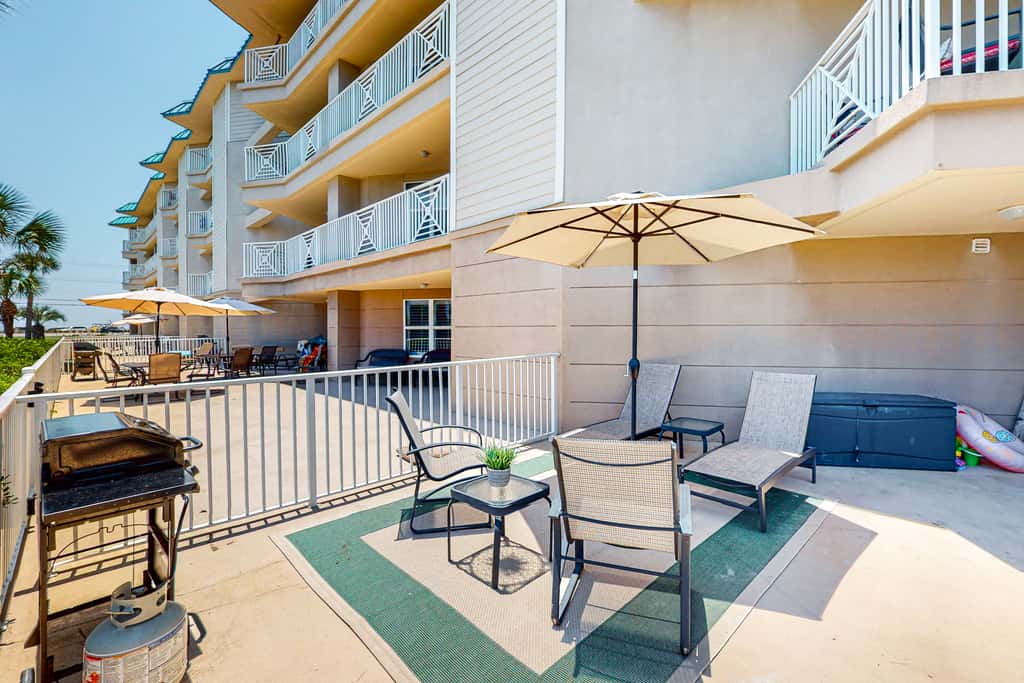 Ground-floor condo with large patio, pools, tennis, & parking - steps to beach