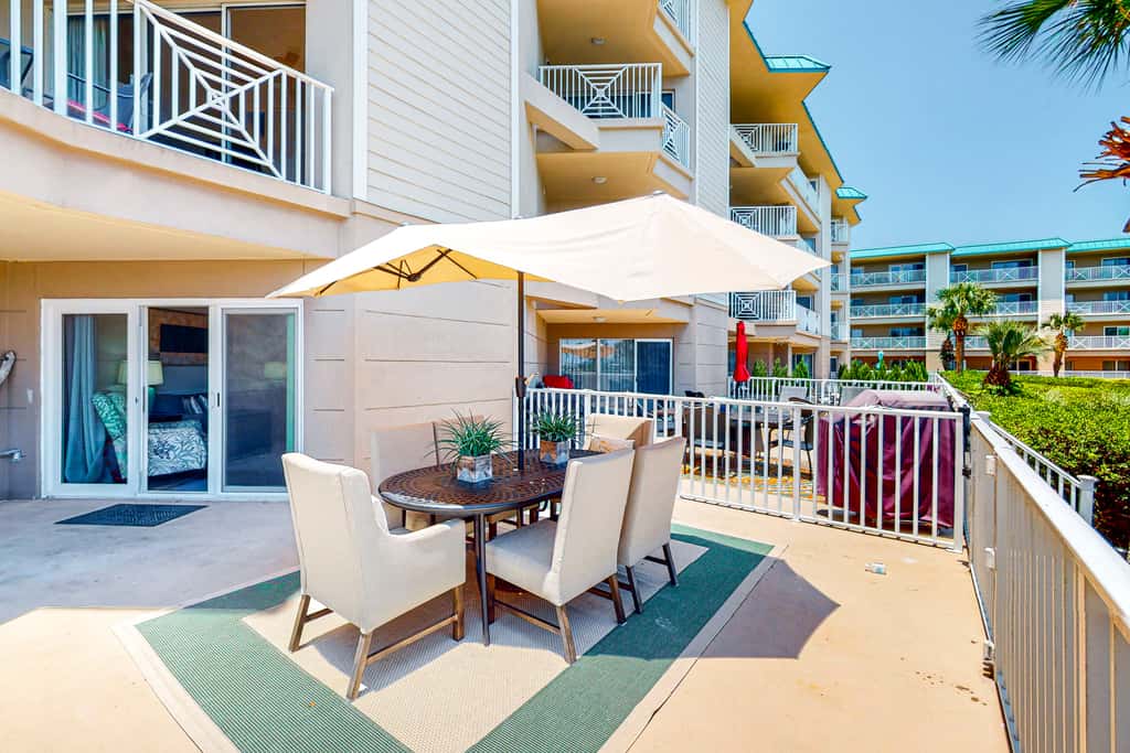 Ground-floor condo with large patio, pools, tennis, & parking - steps to beach