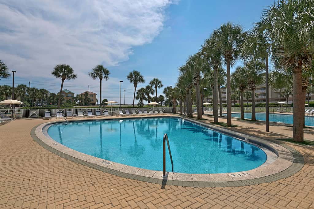 Ground-floor condo with large patio, pools, tennis, & parking - steps to beach