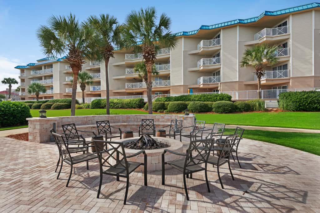 Ground-floor condo with large patio, pools, tennis, & parking - steps to beach