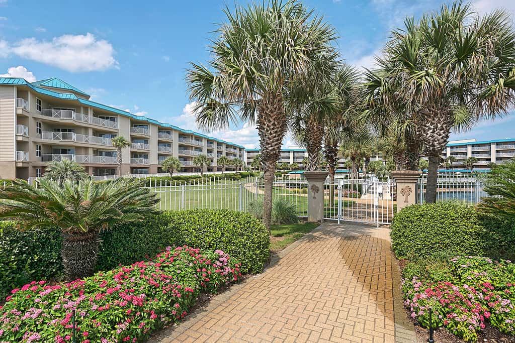 Ground-floor condo with large patio, pools, tennis, & parking - steps to beach