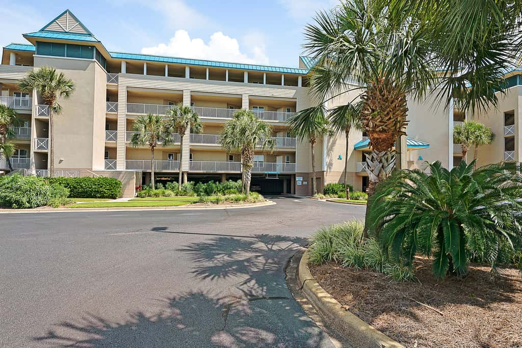 Ground-floor condo with large patio, pools, tennis, & parking - steps to beach
