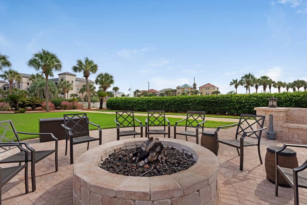 Ground-floor condo with large patio, pools, tennis, & parking - steps to beach
