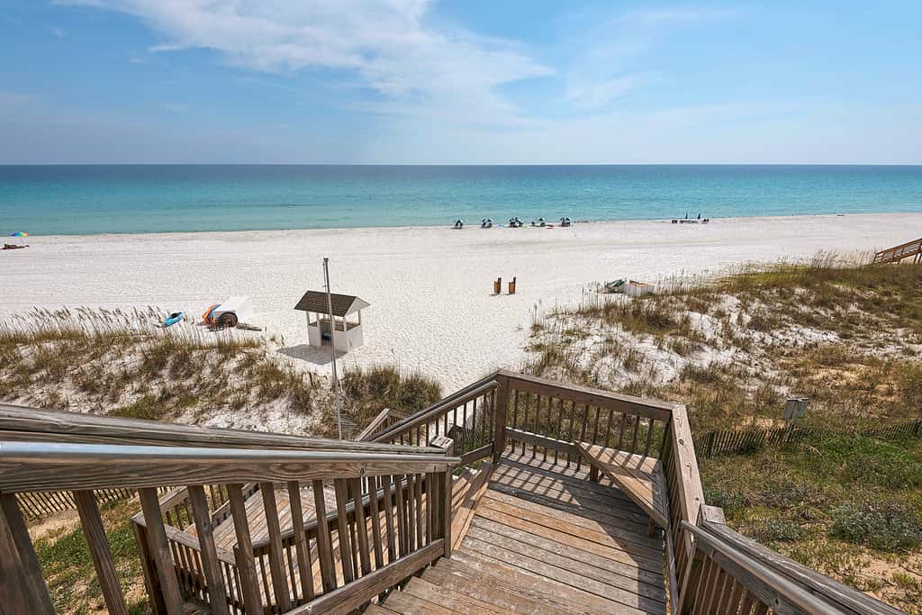 Ground-floor condo with large patio, pools, tennis, & parking - steps to beach