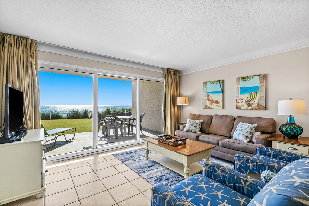 Gulf and beachfront condo with furnished patio, outdoor pool, gym & tennis