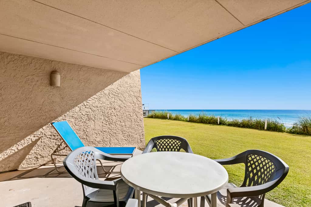 Gulf and beachfront condo with furnished patio, outdoor pool, gym & tennis