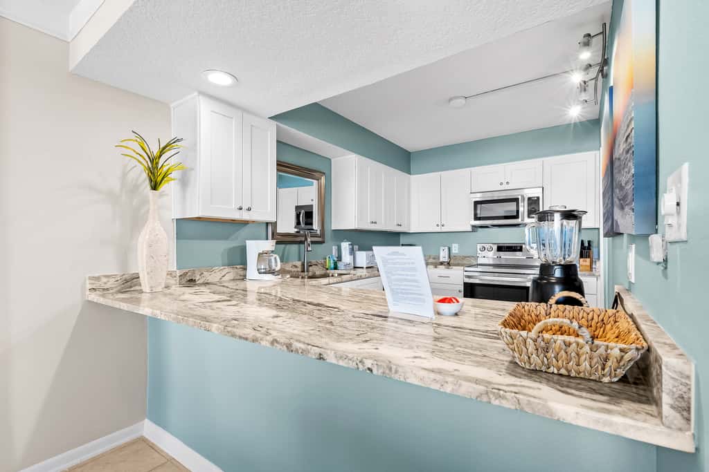 Gulf and beachfront condo with furnished patio, outdoor pool, gym & tennis
