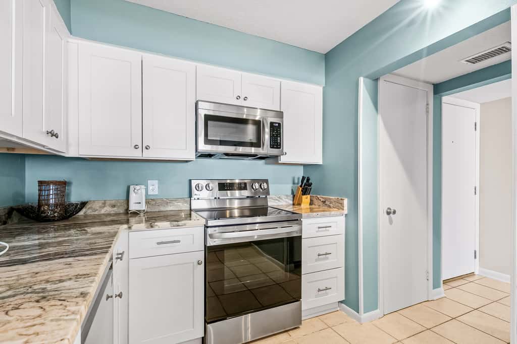 Gulf and beachfront condo with furnished patio, outdoor pool, gym & tennis