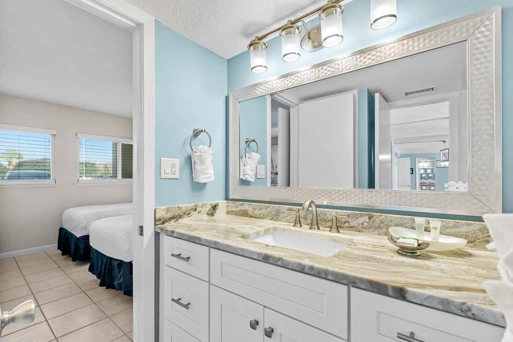 Gulf and beachfront condo with furnished patio, outdoor pool, gym & tennis