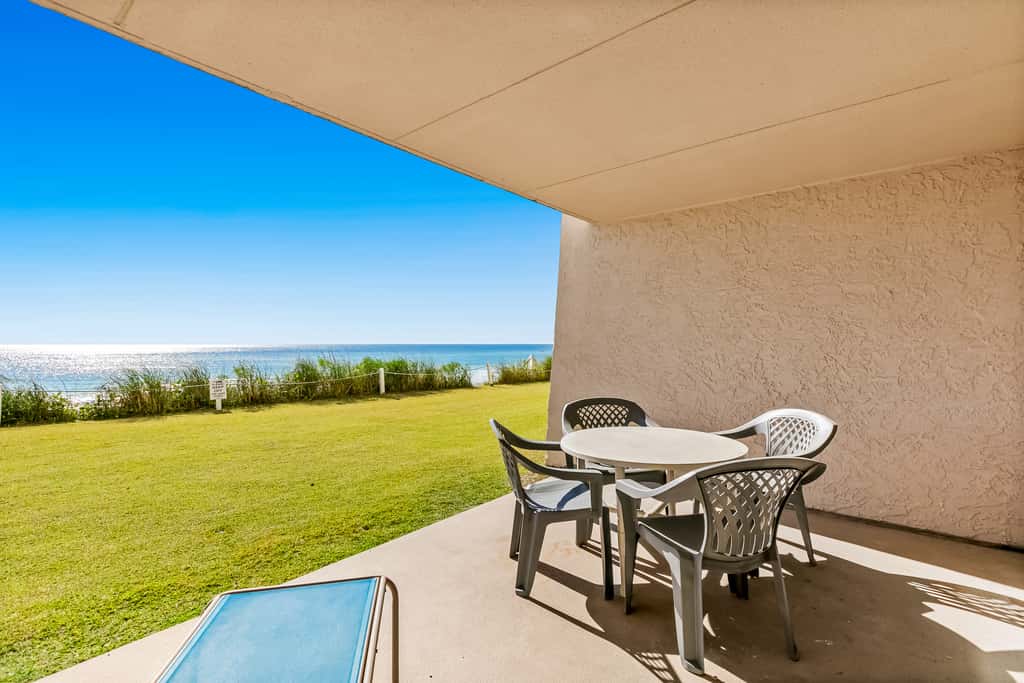 Gulf and beachfront condo with furnished patio, outdoor pool, gym & tennis