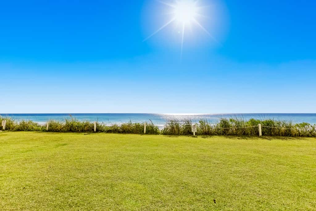 Gulf and beachfront condo with furnished patio, outdoor pool, gym & tennis