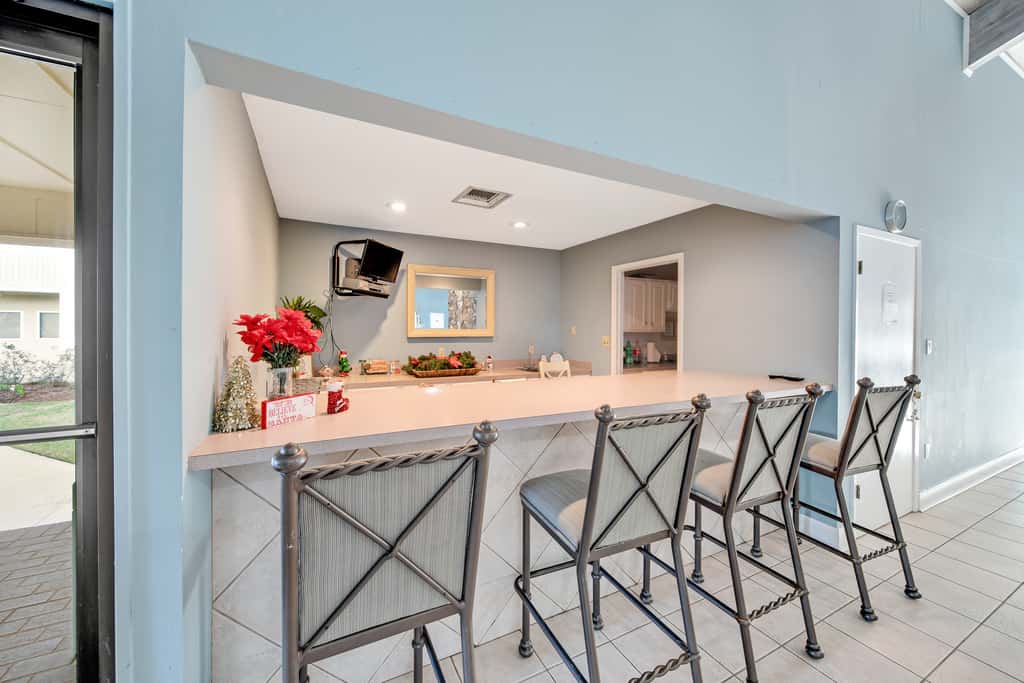 Gulf and beachfront condo with furnished patio, outdoor pool, gym & tennis