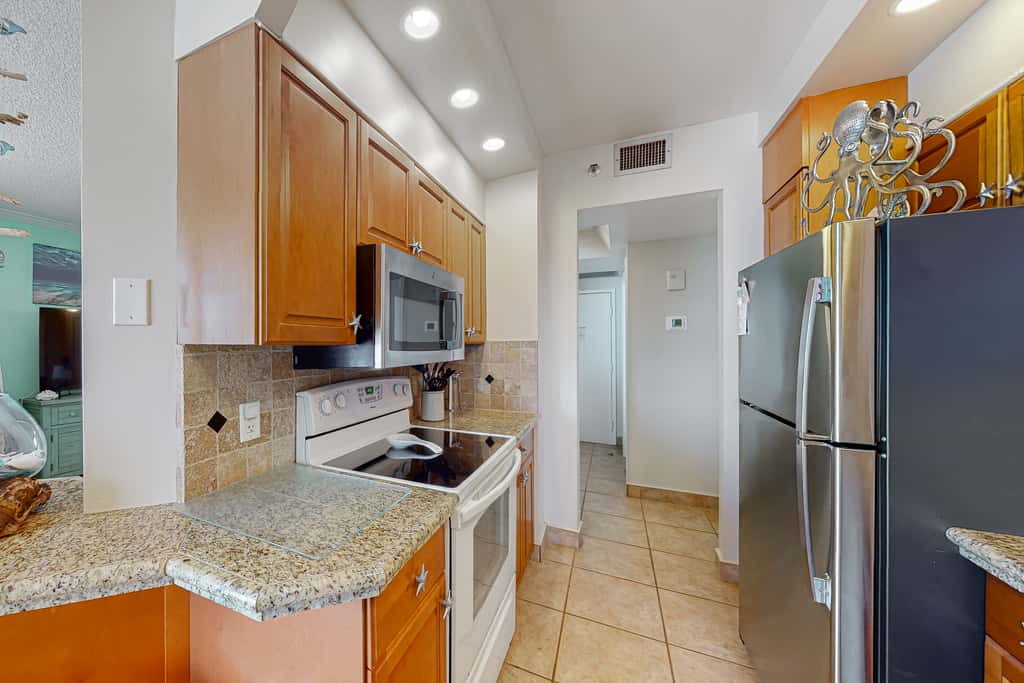 Gulf-view resort condo with pool, hot tubs, & over-street beach access