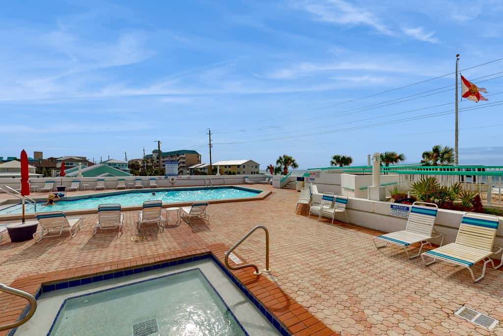 Gulf-view resort condo with pool, hot tubs, & over-street beach access