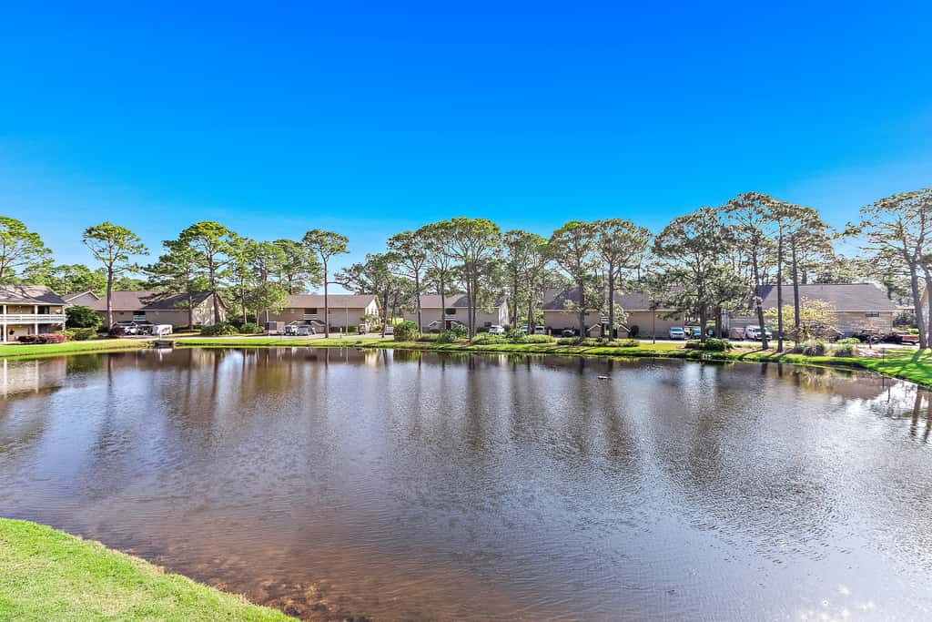 Lakefront condo with on-site golf, pool access, tennis, gym, & balcony