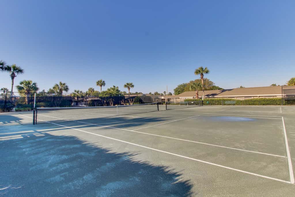 Lakefront condo with on-site golf, pool access, tennis, gym, & balcony