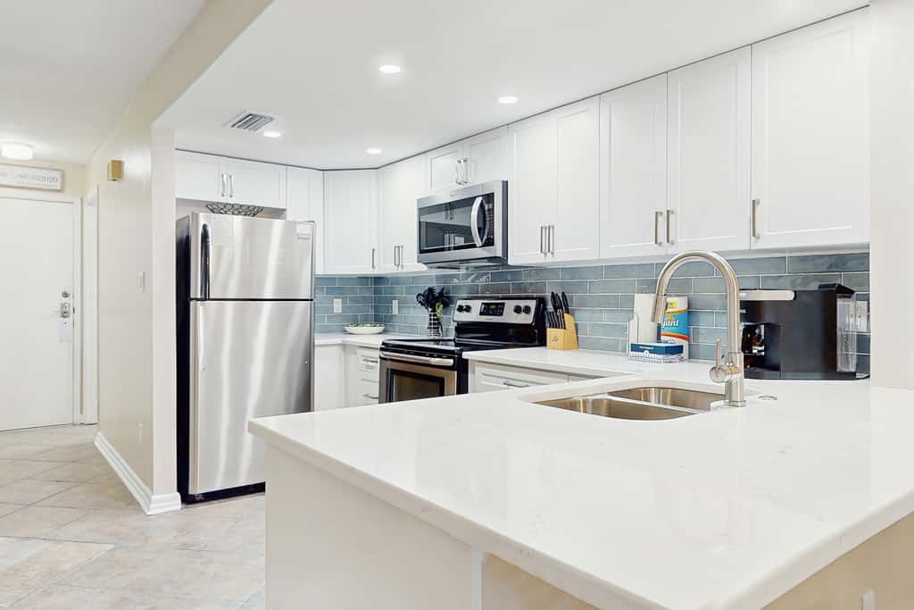 Waterfront townhome with pools, tennis & beach access