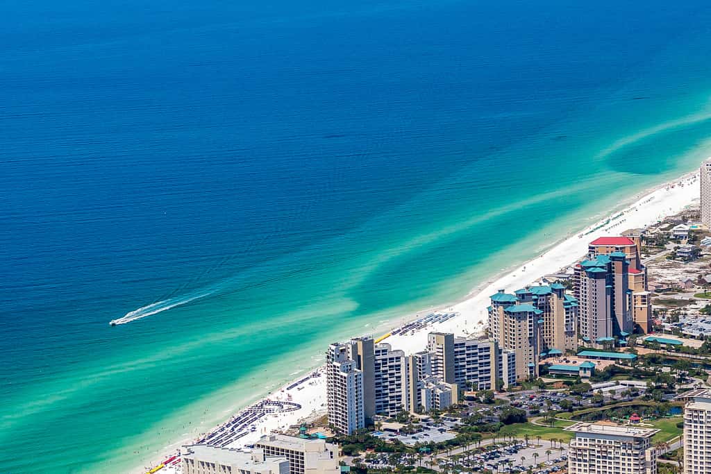 Beautiful beachfront condo with pool, beach tram, tennis, golf, & on-site dining
