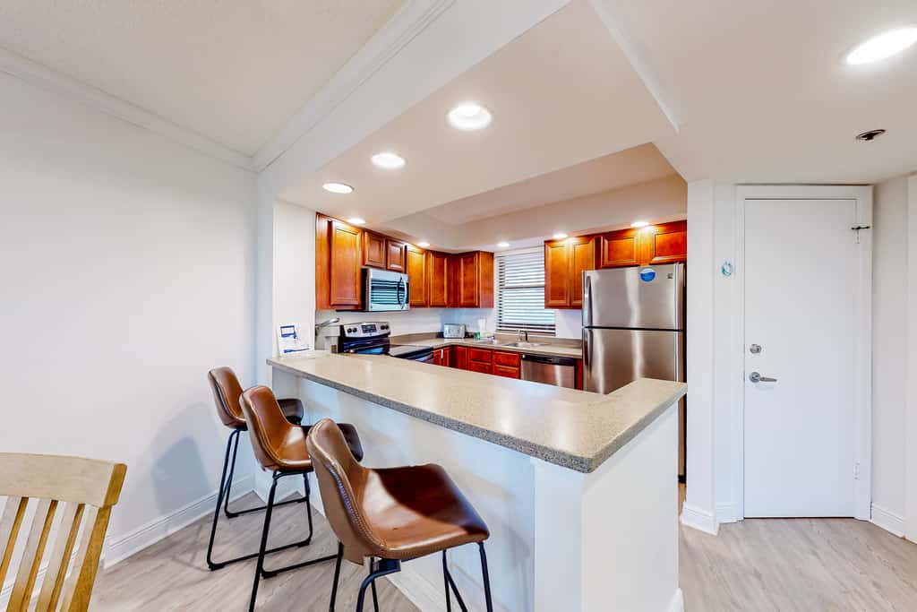 Beautiful beachfront condo with pool, beach tram, tennis, golf, & on-site dining