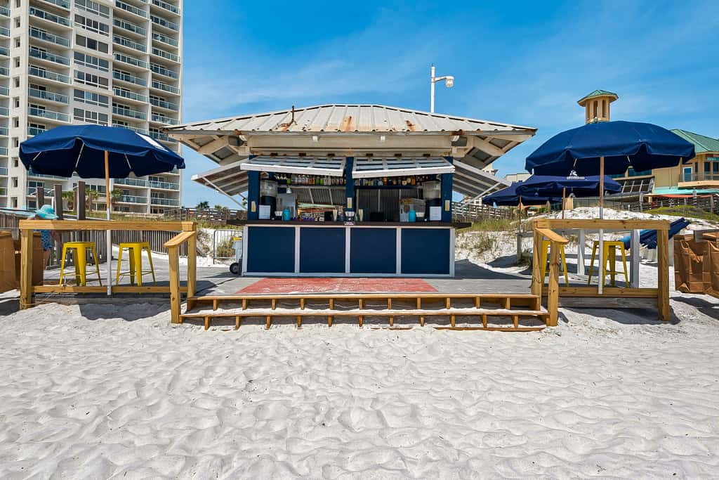 Beautiful beachfront condo with pool, beach tram, tennis, golf, & on-site dining