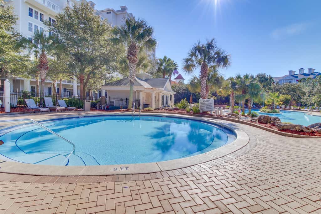 Spacious condo with bay views, renovated pool, hot tub, & beach access!