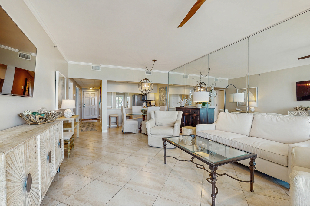 Open-concept beachfront home with balcony, lagoon pool, beach access, pickleball